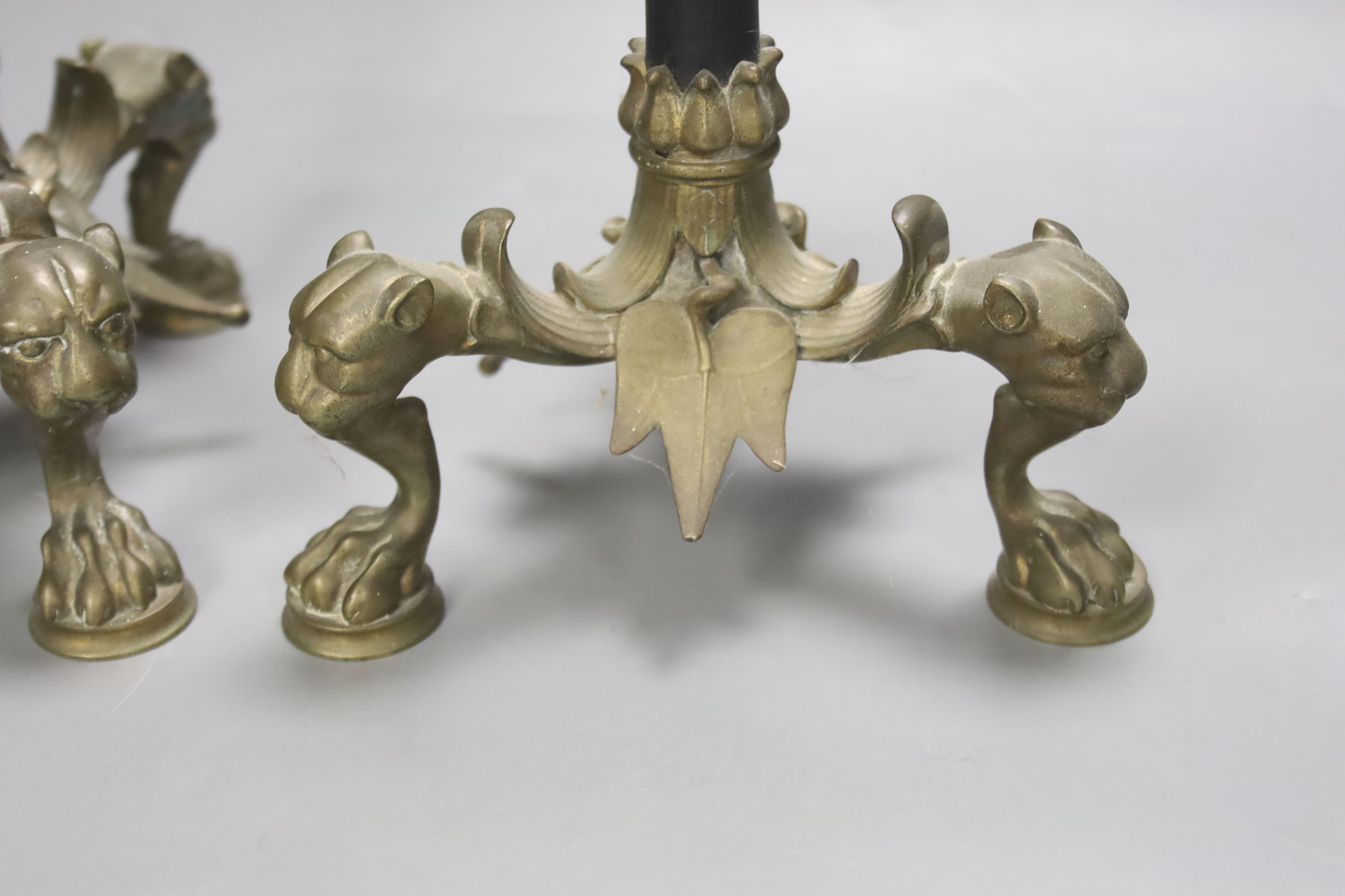 A pair of ormolu candlesticks, with lion paw feet, height 32cm